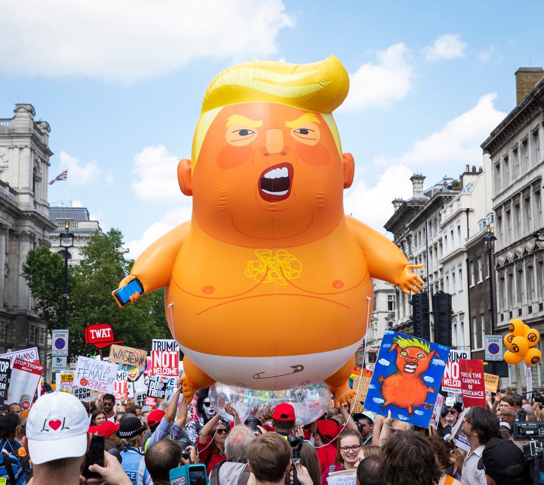 Thousands of protesters march alongside the 'Trump baby' balloon in central London during President Trump's visit to the U.K. on July 13, 2018. (Rob Pinney/LNP/Shutterstock)